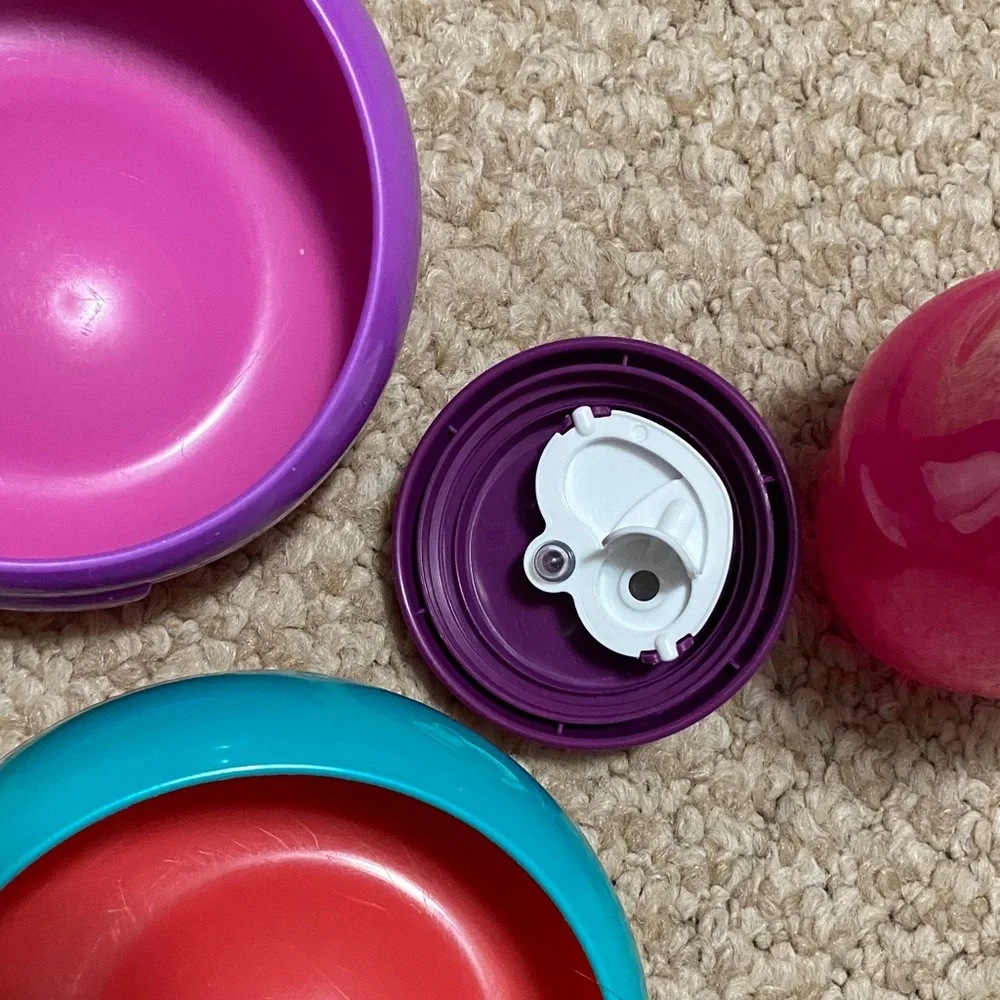 2 bibs, green & blue, 2 suction bowls, pink & purple, 1 tommie tippie sippie cup